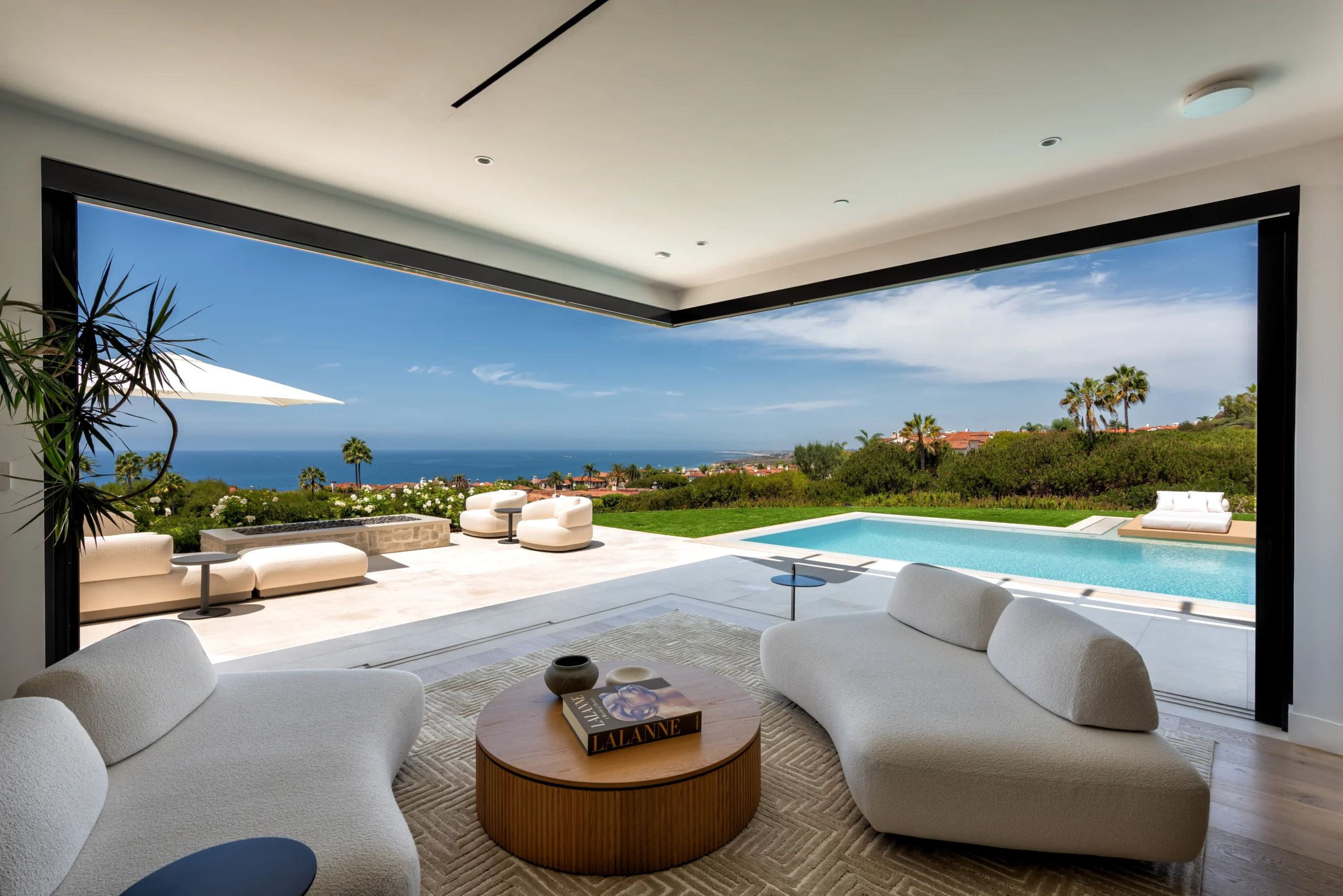 View from the indoor lounge overlooking the pool and Pacific Ocean view